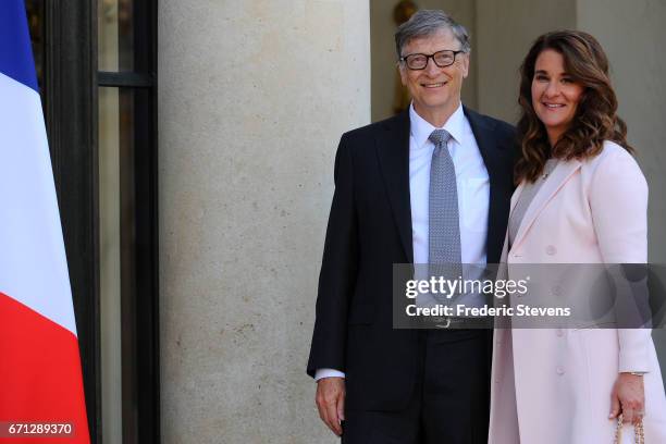 Bill and Melinda Gates pose in front of the Elysee Palace before receiving the award of Commander of the Legion of Honor by French President Francois...