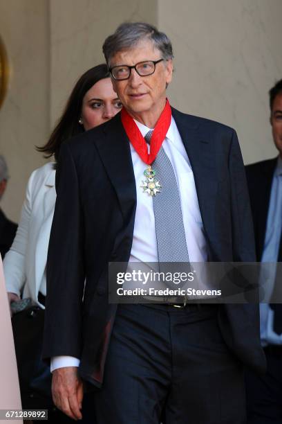 Bill Gates poses in front of the Elysee Palace after receiving the award of Commander of the Legion of Honor by French President Francois Hollande on...