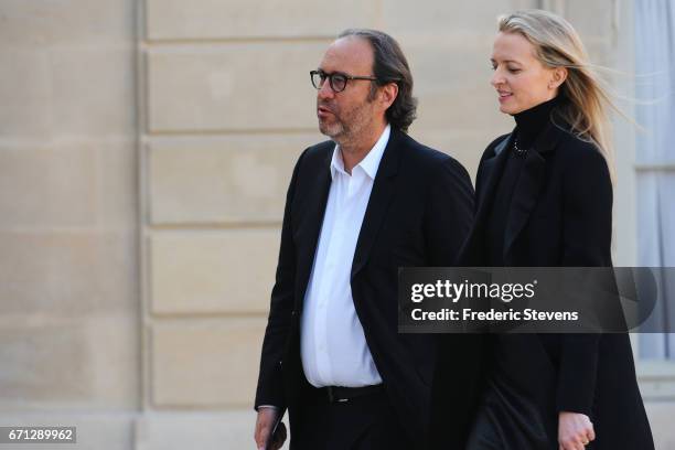 Xavier Niel chief executive officer of Free and his wife Delphine Arnault arrive at the Elysee Palace where Bill and Melinda Gates receiving the...