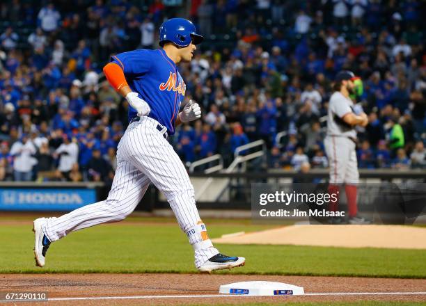 Michael Conforto of the New York Mets runs the bases after his first inning home run against Tanner Roark of the Washington Nationals at Citi Field...