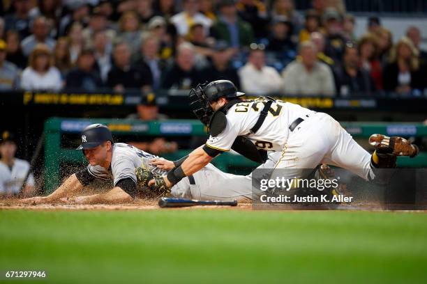 Chase Headley of the New York Yankees is tagged out by Francisco Cervelli of the Pittsburgh Pirates in the second inning at PNC Park on April 21,...