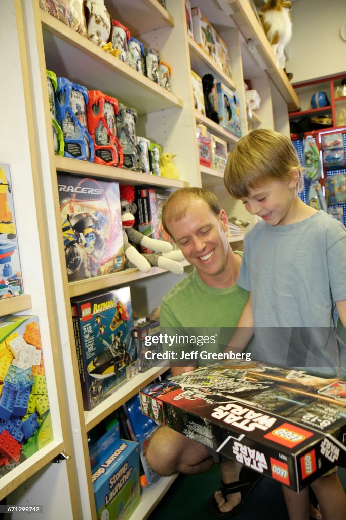 A father and son looking at Lego Star Wars in Toy Harbor.