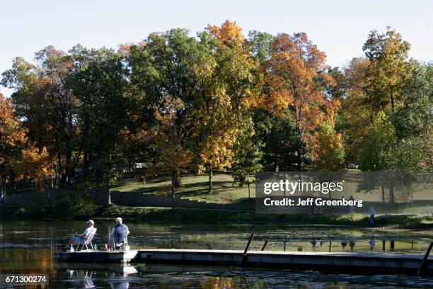 Two men fishing at Rogers Lakewood Park.
