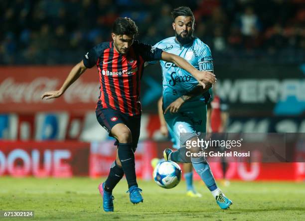 Nicolas Blandi of San Lorenzo fights for the ball with Gaston Aguirre of Temperley during a match between San Lorenzo and Temperley as part of Torneo...