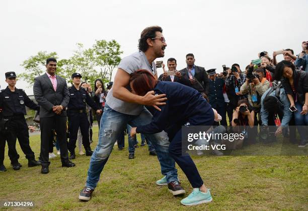 Bollywood actor Aamir Khan wrestles with a female wrestler at Mount Qingcheng on April 20, 2017 in Chengdu, China.