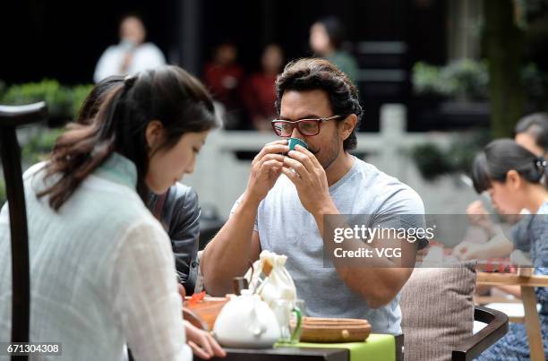 Bollywood actor Aamir Khan tastes local tea at Thatched Cottage of Du Fu on April 20, 2017 in Chengdu, China.