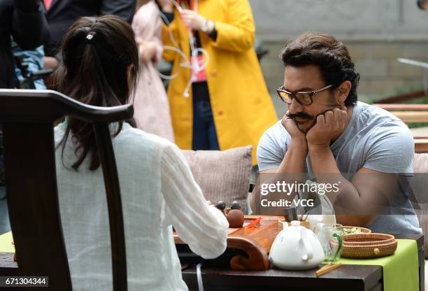 Bollywood actor Aamir Khan tastes local tea at Thatched Cottage of Du Fu on April 20, 2017 in Chengdu, China.