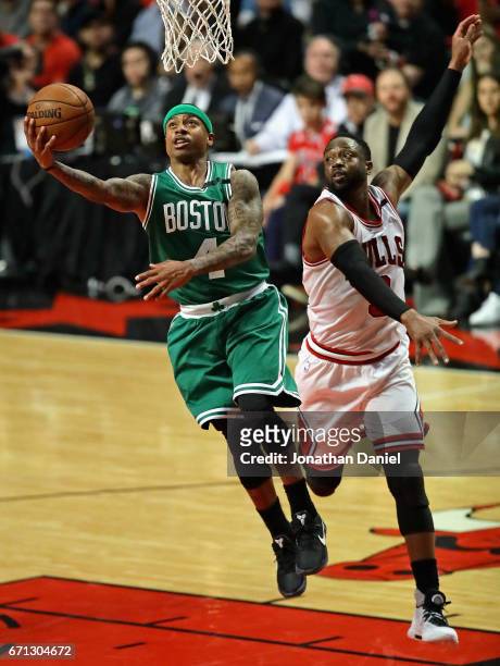Isaiah Thomas of the Boston Celtics drives to the basket past Dwyane Wade of the Chicago Bulls during Game Three of the Eastern Conference...
