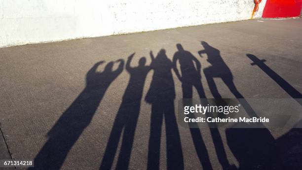 shadow family portrait... - catherine macbride stock pictures, royalty-free photos & images