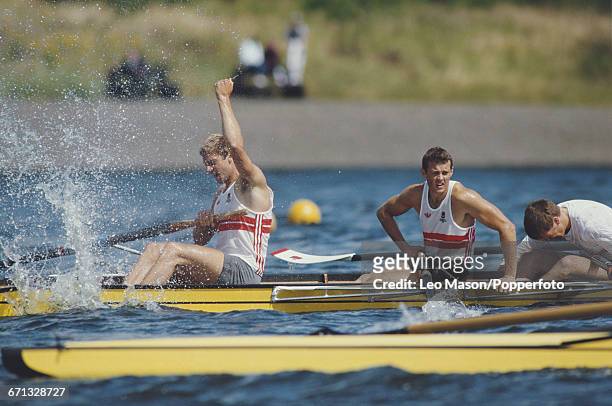 English rower Steve Redgrave raises one arm in the air in celebration after the England coxed fours boat finished in first place to win the gold...