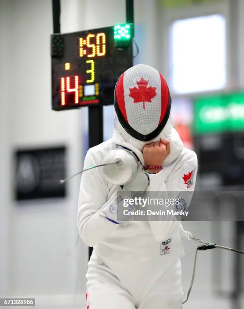 Ariane Leonard celebrates a 15-14 victory in the gold medal match of the Cadet Women's Epee event on April 21, 2017 at the Canadian National Fencing...