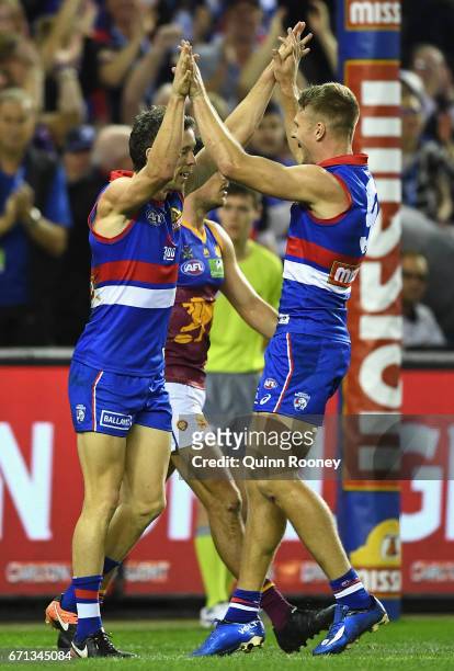 Robert Murphy of the Bulldogs is congratulated by Jake Stringer after kicking a goal during the round five AFL match between the Western Bulldogs and...