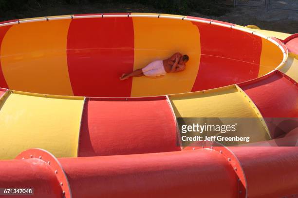 Man going down a water slide at a Waterpark in Point Mallard Park.