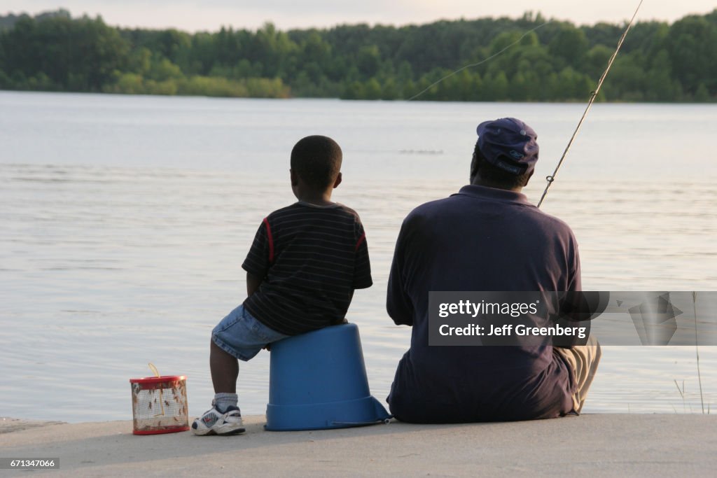 A father and son fishing in Chattahoochee River.