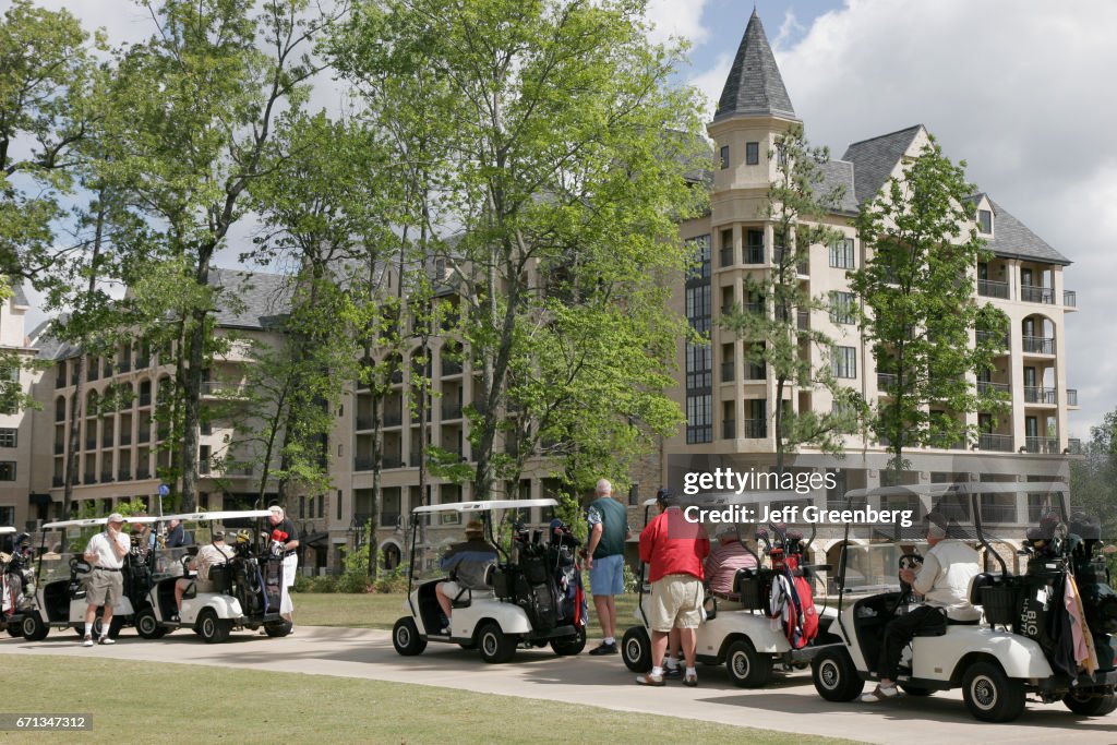 Players on electric carts at Renaissance Ross Bridge Golf Resort and Spa.