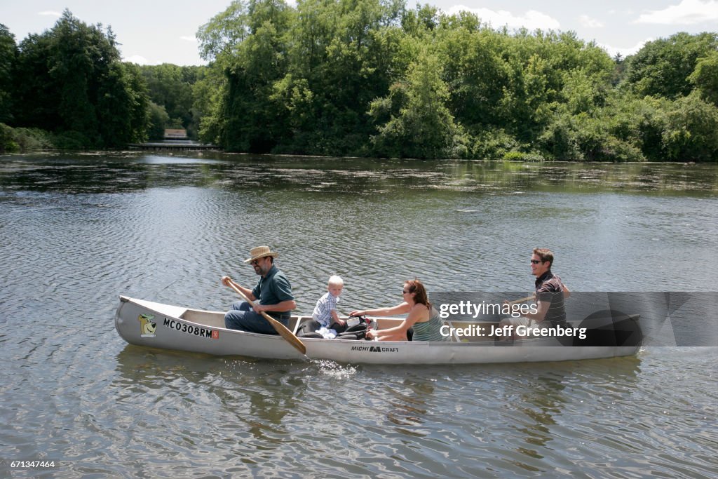 A family in a canoe on Huron River.