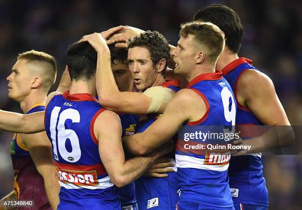 Robert Murphy of the Bulldogs celebrates a goal with team mates during the round five AFL match between the Western Bulldogs and the Brisbane Lions...