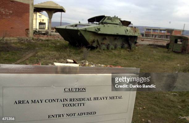 Warning sign cautions "Area May Contain Residual Heavy Metal Toxicity, Entry Not Advised" January 12, 2001 in Klina, Kosovo at one of 112 sites where...