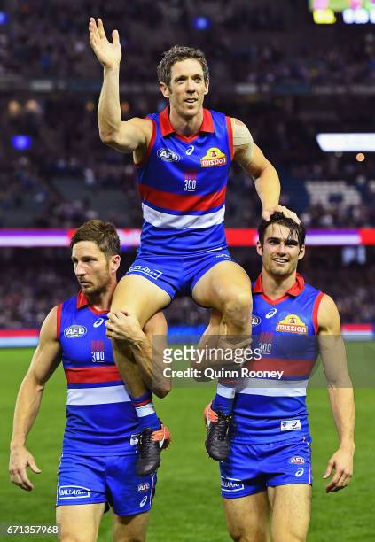 Robert Murphy of the Bulldogs is chaired off the ground in his 300th game during the round five AFL match between the Western Bulldogs and the...