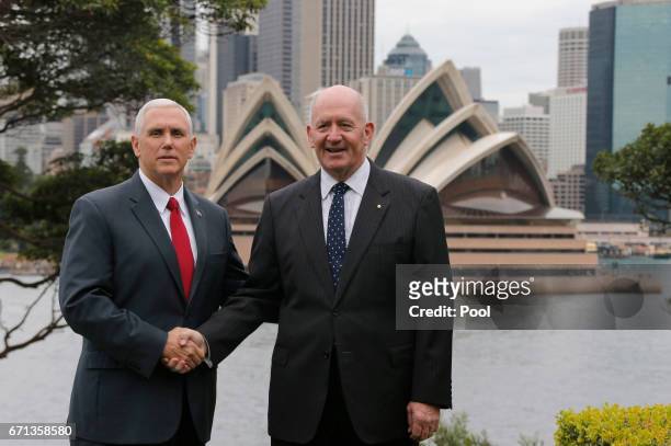 Vice President Mike Pence poses in front of the Sydney Opera House with Australia's Governor-General Peter Cosgrove at Admiralty House on April 22,...