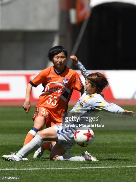 Rina Kosuda of Albirex Nigata and Miki Ito of INAC Kobe Leonessa compete for the ball during the Nadeshiko League match between Albirex Niigata...