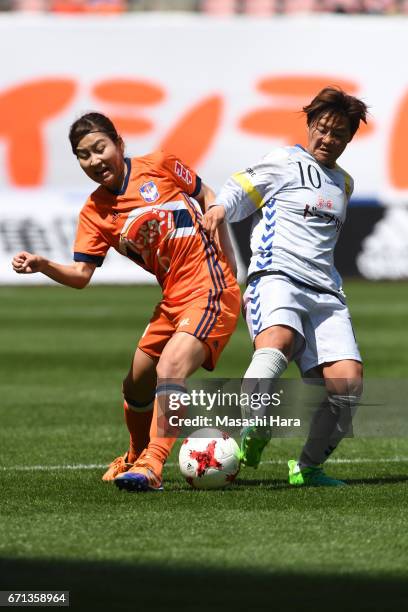 Momoko Sayama of Albirex Nigata and Shinobu Ohno of INAC Kobe Leonessa compete for the ball during the Nadeshiko League match between Albirex Niigata...