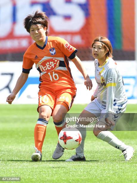 Miyuki Takahashi of Albirex Nigata and Miki Ito of INAC Kobe Leonessa compete for the ball during the Nadeshiko League match between Albirex Niigata...