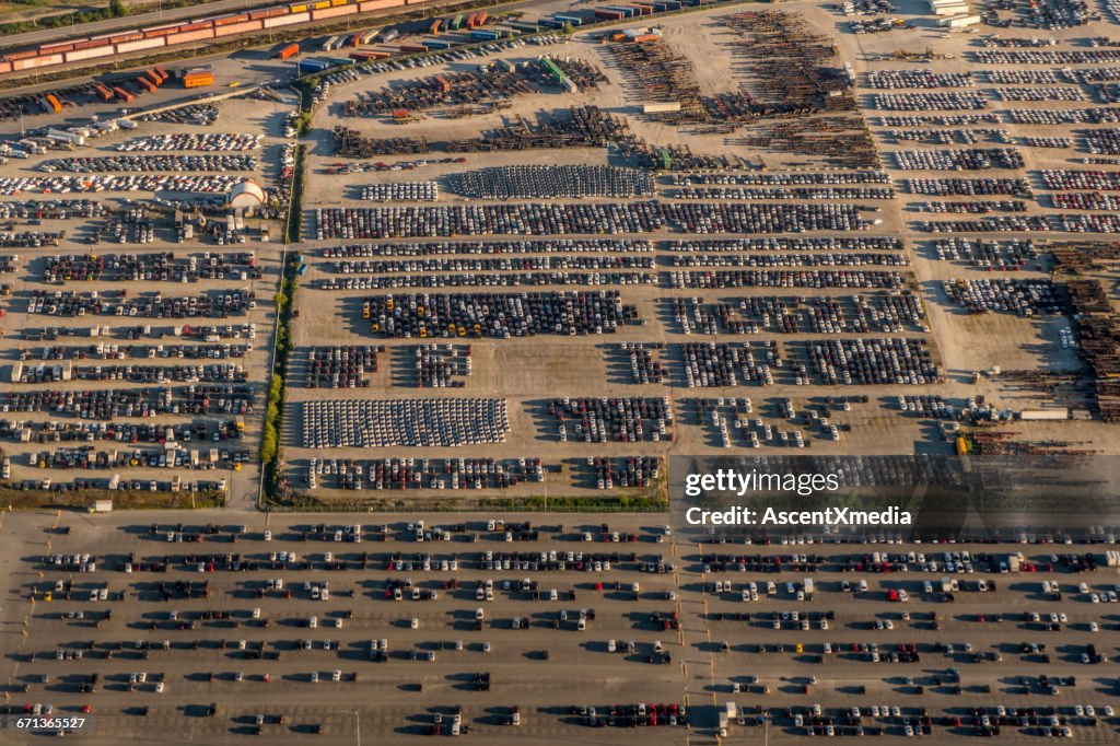 Aerial view of parked cars and train track