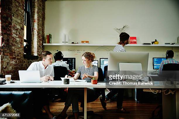 business owner in project discussion with partner - small office stock pictures, royalty-free photos & images