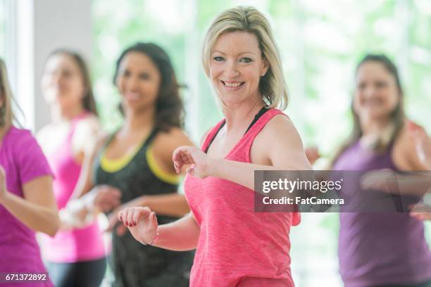 smiling - aerobics stock pictures, royalty-free photos & images