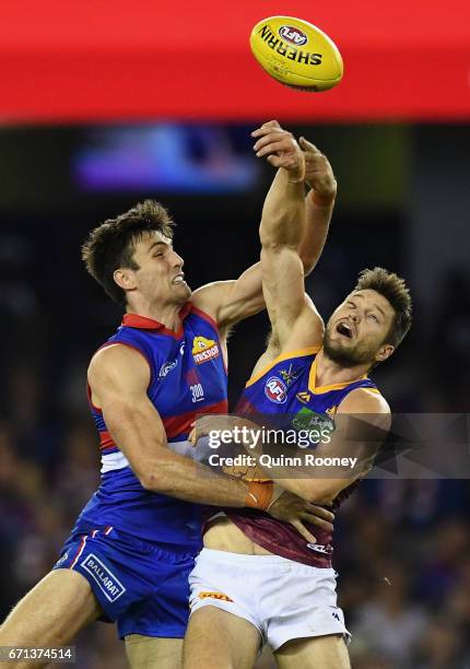 Tom Campbell of the Bulldogs and Stefan Martin of the Lions compete in the ruck during the round five AFL match between the Western Bulldogs and the...