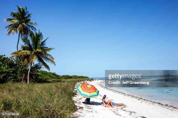 Sunbathers on the beach at Bahia Honda State Park.