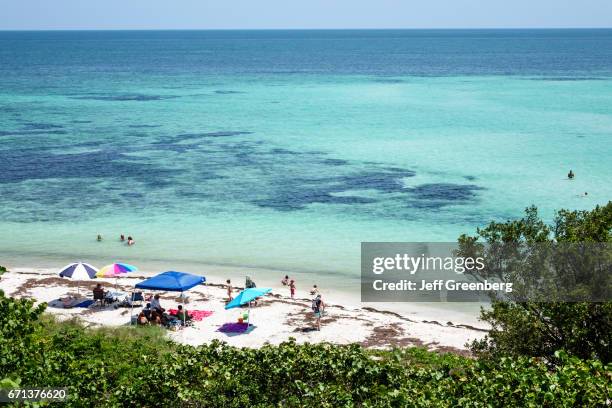 Sunbathers on the beach at Bahia Honda State Park.