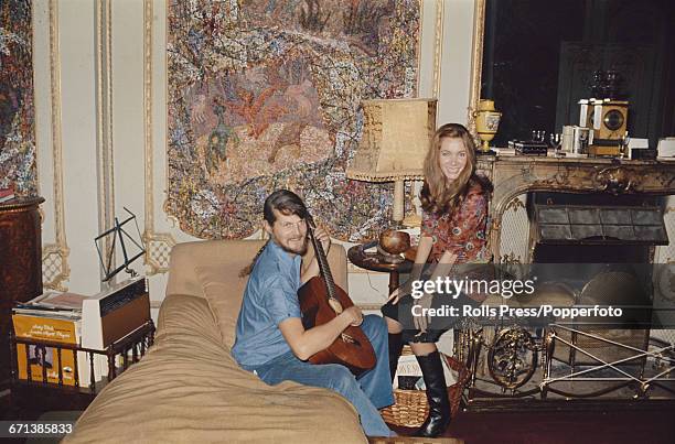 Alexander Thynne, Viscount Weymouth pictured playing an acoustic guitar with his wife Anna Thynne at Longleat House near Warminster in Somerset,...