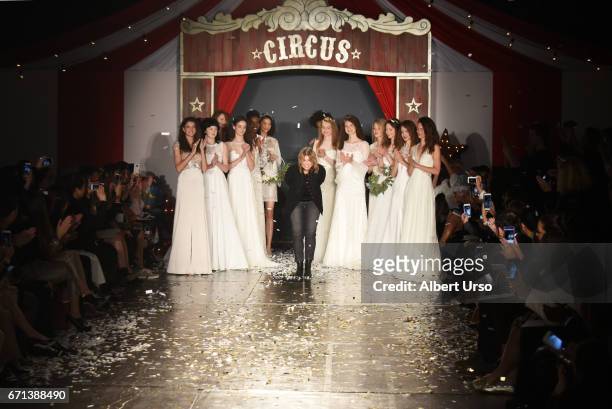 Designer Jenny Packham walks the runway with models at the Jenny Packham show during New York Fashion Week: Bridal on April 21, 2017 in New York City.