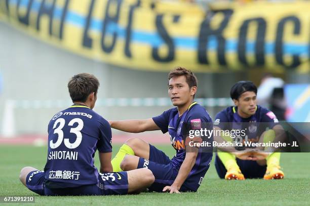 Tsukasa Shiotani, Toshihiro Aoyama and Masato Kudo of Sanfrecce Hiroshima show dejection after the 3-3 draw in the J.League J1 match between...