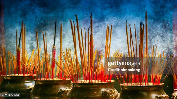 incense sticks burning in ho chi minh city temple - incense stock pictures, royalty-free photos & images