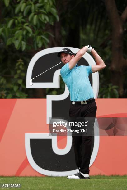Gregory Bourdy of France tees off a Hole-In-One shot at Tee No.3 during the third round of the Shenzhen International at Genzon Golf Club on April...