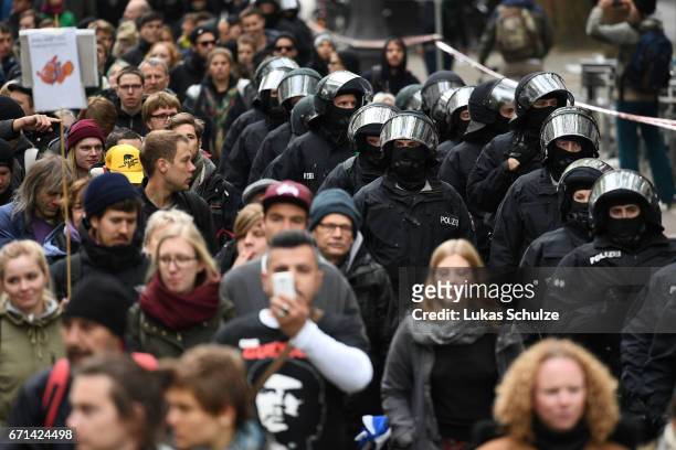 Protesters are escorted by police during their protest against the right-wing populist Alternative for Germany political party federal congress on...