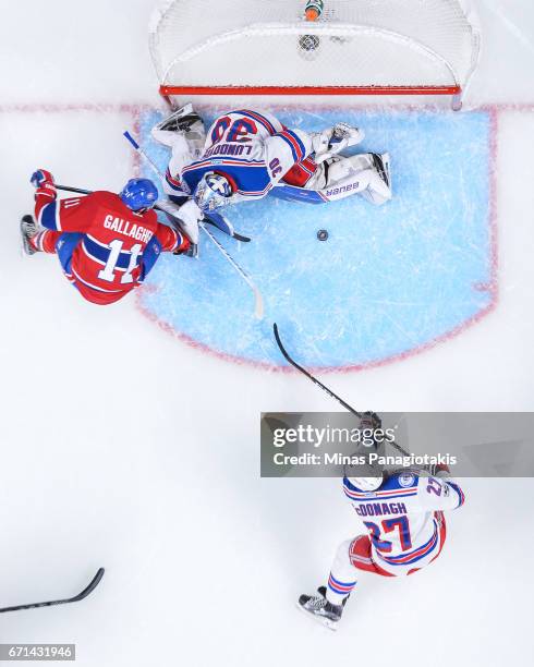 Goaltender Henrik Lundqvist of the New York Rangers stops Brendan Gallagher of the Montreal Canadiens in Game Five of the Eastern Conference First...