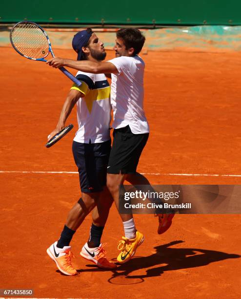 Marc Lopez and Feliciano Lopez of Spain celebrate match point against Pierre-Hughes Herbert and Nicolas Mahut of France in their semi final doubles...