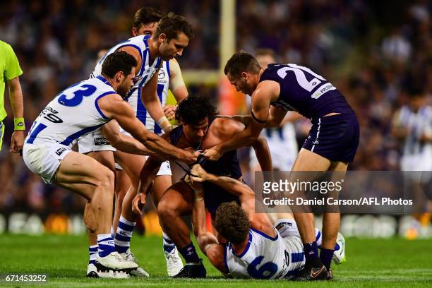 Brady Grey of the Dockers is pulled off Lachlan Hansen of the Kangaroos during the 2017 AFL round 05 match between the Fremantle Dockers and the...