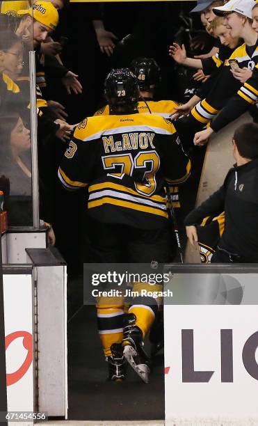 Fans interact with Charles McCoy of the Boston Bruins before a contest against Ottawa Senators in Game Three of the Eastern Conference First Round...