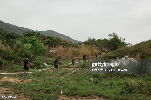 Competitors carry the sand bags during the Spartan Race Asia-Pacific on April 22, 2017 in Hong Kong, Hong Kong. Thousands of competitors from over 20...