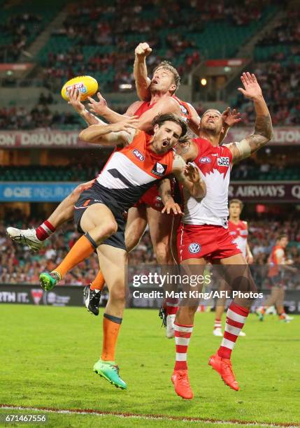 Luke Parker and Lance Franklin of the Swans competes for the ball against Phil Davis of the Giants during the round five AFL match between the Sydney...