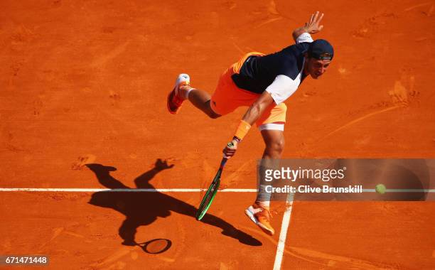 Lucas Pouille of France plays a backhand against Albert Ramos-Vinolas of Spain in their semi final round match on day seven of the Monte Carlo Rolex...