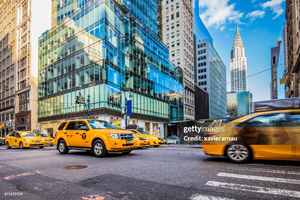 Yellow taxis on busy street in New York City
