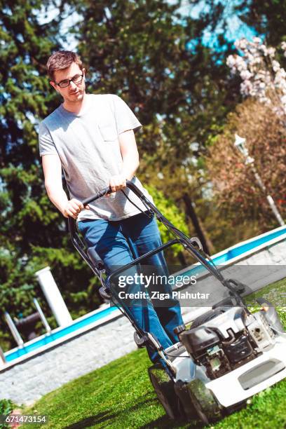 young adult working in the back yard - effort work stock pictures, royalty-free photos & images
