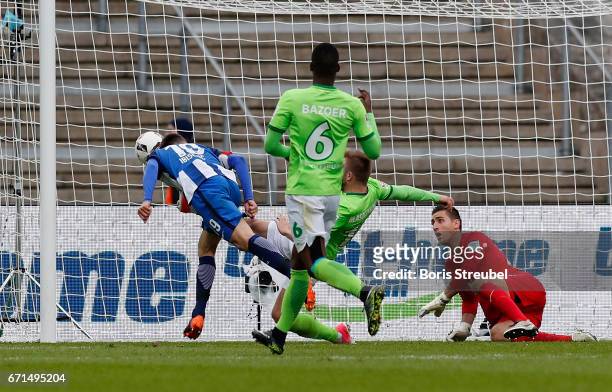 Vedad Ibisevic of Hertha BSC scores his team's first goal against goalkeeper Koen Casteels of VfL Wolfsburg with a header during the Bundesliga match...