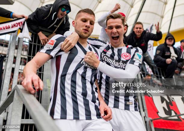 Ante Rebic of Frankfurt celebrates the third goal for his team with Guillermo Varela of Frankfurt during the Bundesliga match between Eintracht...